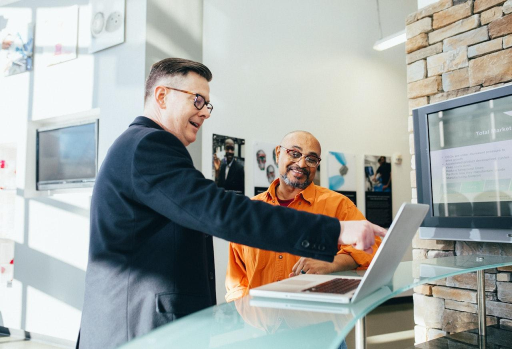 Two men talking with each other about business